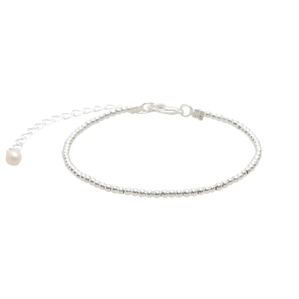 Lotus & Luna 2 mm silver bead bracelet – dainty silver-plated ball stacking bracelet for minimalist layering.