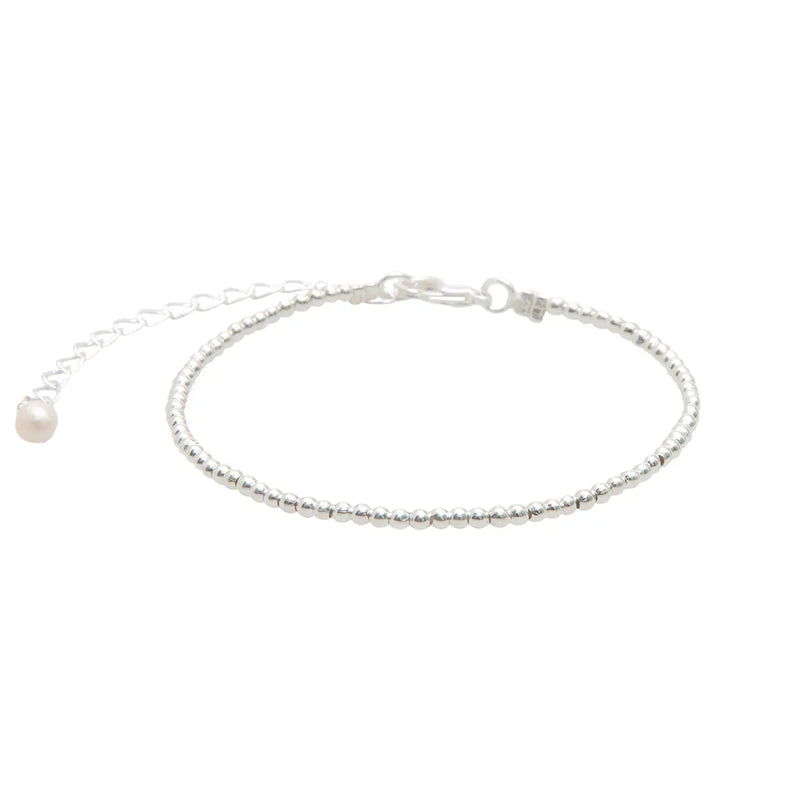 Lotus & Luna 2 mm silver bead bracelet – dainty silver-plated ball stacking bracelet for minimalist layering.