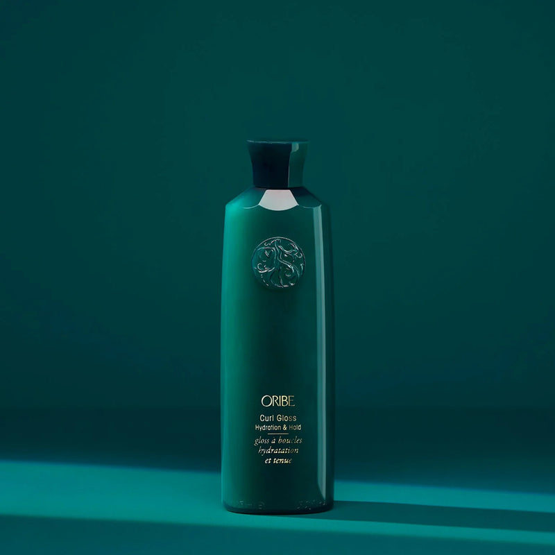 Oribe Curl Gloss Hydration & Hold – lightweight, gold-flecked curl glossing gel infused with passionflower, cupuaçu, Brazilian jicama and nut extracts for frizz-resistant, defined curls with shine and memory.