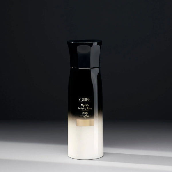 Oribe Mystify Restyling Spray – lightweight hydrating mist with avocado oil, lactic acid & bio‑restorative complex to refresh, detangle and heat‑protect second‑day styles.