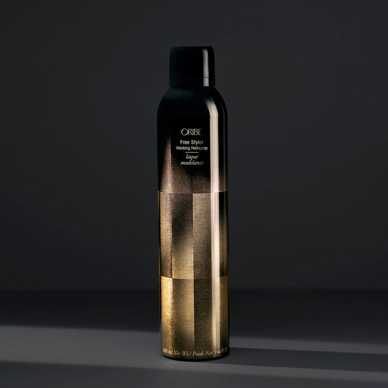 Oribe Free Styler Working Hair Spray – flexible hold finishing spray for all hair types, lightweight, brushable, humidity-resistant, and adds natural shine.
