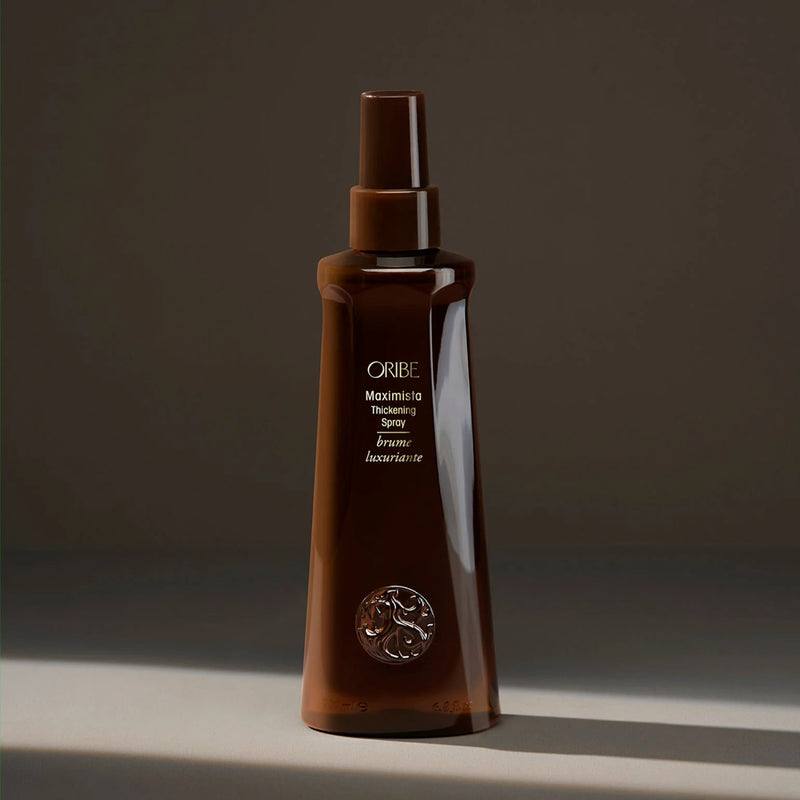 Oribe Maximista Thickening Spray – lightweight thermal‑protective mist that delivers exaggerated volume, root lift and medium hold for fine or thinning hair.