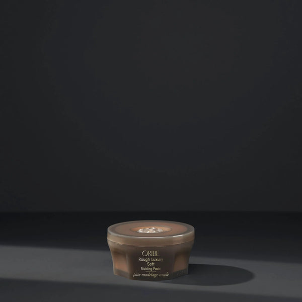 Oribe Rough Luxury Soft Molding Paste – creamy moldable paste wax offering medium hold with memory, soft shine, and flexible definition for short cuts and long layers.