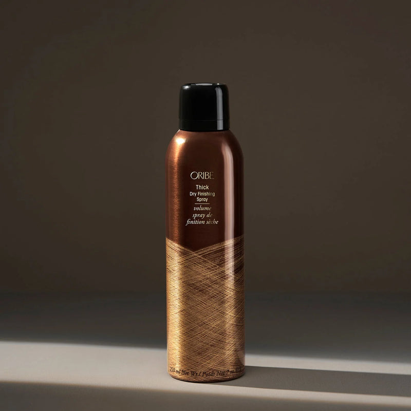 Oribe Thick Dry Finishing Spray – high‑density dry finishing spray that inflates hair for extra thickness and lushness, lightweight volumizing aerosol with dry hold and no stickiness.