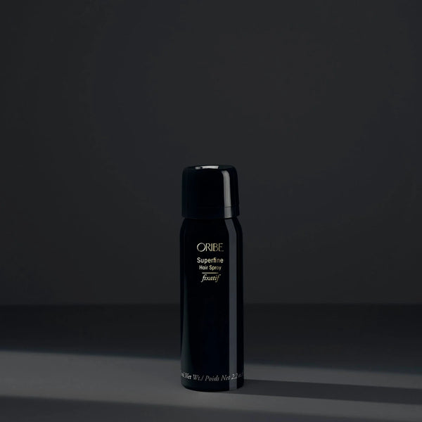 Oribe Travel Size Superfine Hair Spray – ultra-fine aerosol mist with medium but brushable hold, ultra-dry finish and lightweight control in a compact 2.2 oz travel format.