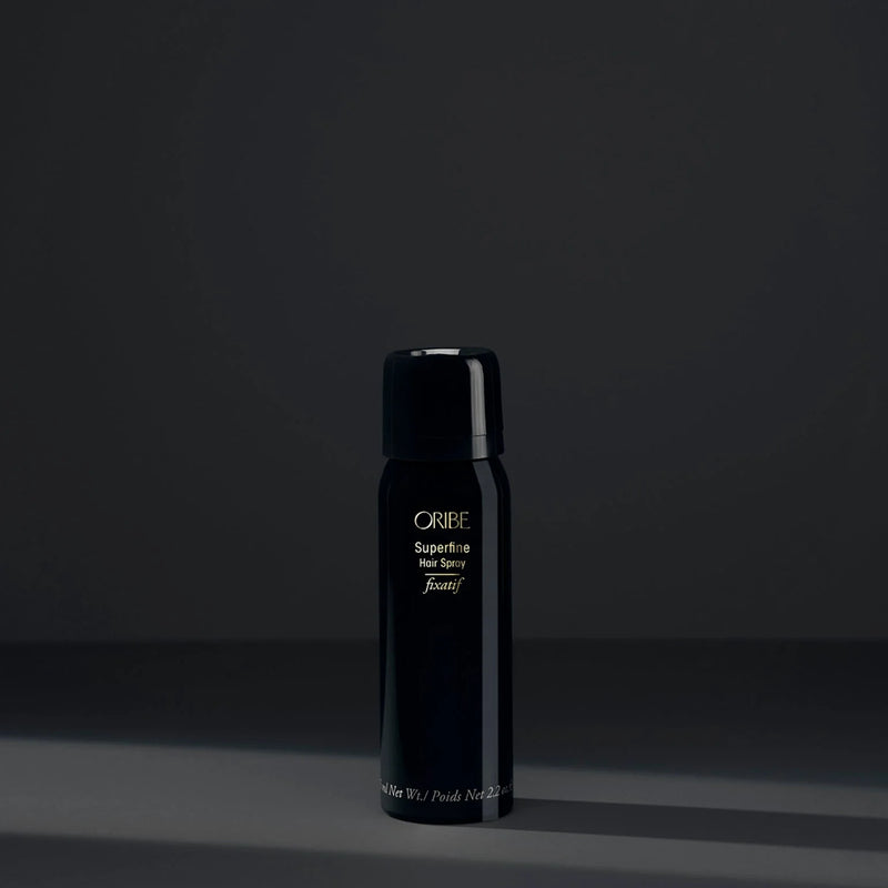 Oribe Travel Size Superfine Hair Spray – ultra-fine aerosol mist with medium but brushable hold, ultra-dry finish and lightweight control in a compact 2.2 oz travel format.