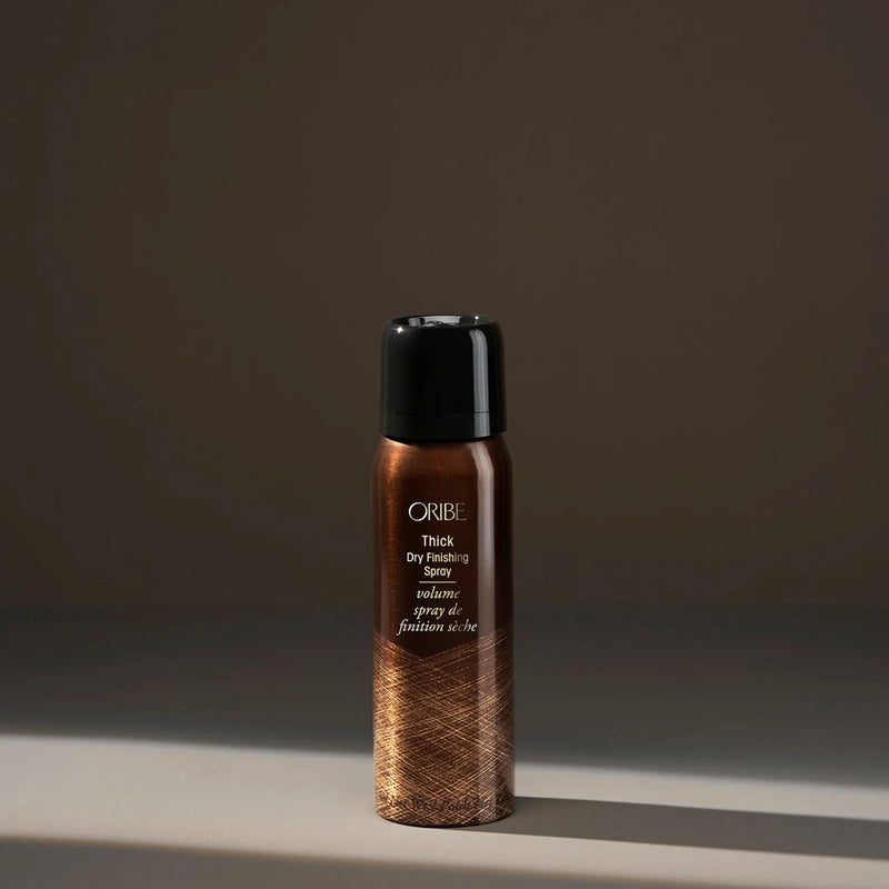 Oribe Travel Size Thick Dry Finishing Spray – lightweight volumizing aerosol spray that adds instant thickness and dry hold without stickiness, for fine to normal hair.