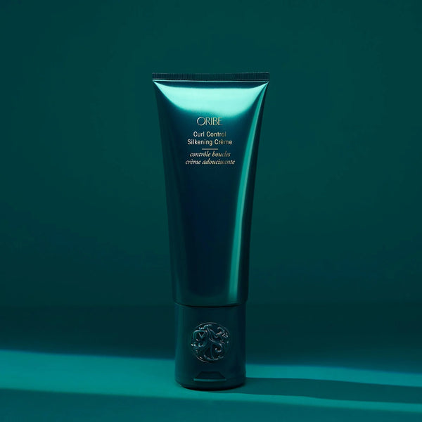 Oribe Curl Control Silkening Crème – silk‑light curl cream infused with avocado, apricot, coconut and jojoba oils plus Oribe Signature Complex for frizz‑controlled, defined, soft curls.