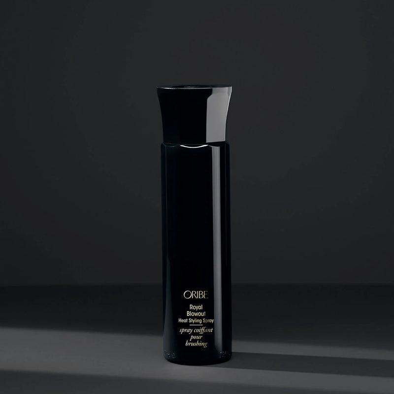 Oribe Royal Blowout Heat Styling Spray – ultra-lightweight sleekening mist with argan oil, ceramides and silicone complex; smooths frizz, seals split ends, speeds blow‑dry and adds body & shine.