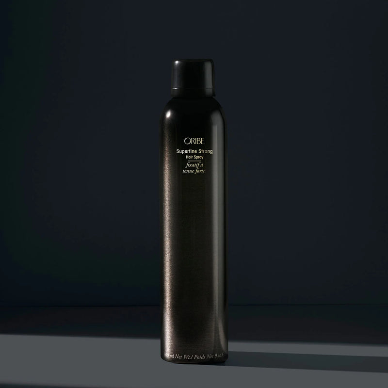 Oribe Superfine Strong Hair Spray – ultra-fine aerosol mist delivering sheer, strong hold with natural shine, lightweight and brushable, enriched with Pro‑Vitamin B5 and Signature Botanical Complex.