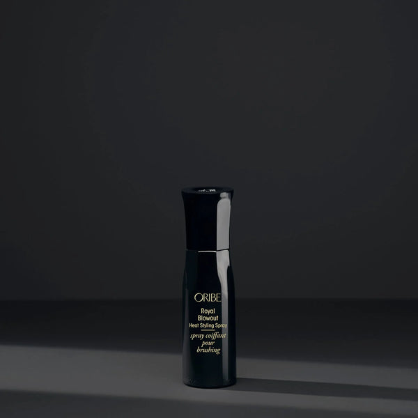 Oribe Royal Blowout Heat Styling Spray travel size – ultra-lightweight sleekening mist that smooths and softens hair, speeds dry time, repairs split ends and adds shine while offering heat protection up to 450 °F.