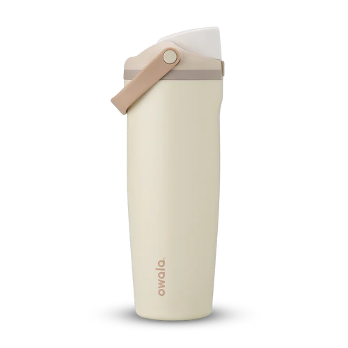 Owala FreeSip Sway bottle in Lightly Toasted – insulated stainless steel tumbler with side handle, leakproof dual-function lid, and soft cream body with warm taupe accents.