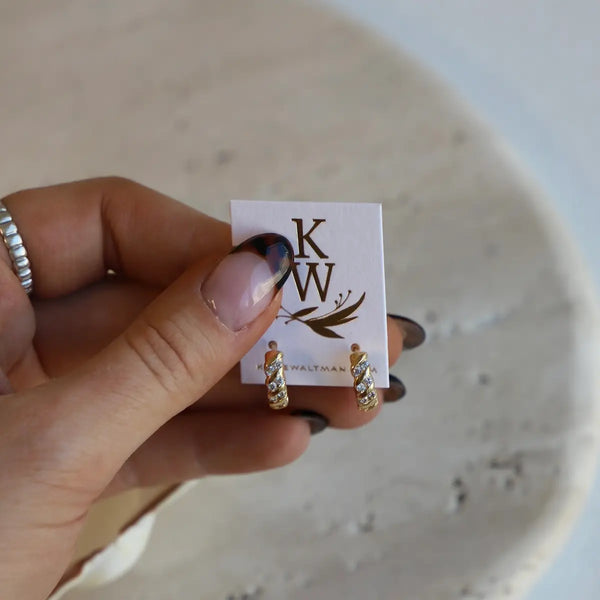 Katie Waltman Jessie CZ rope huggie hoop earrings with twisted gold design and sparkling cubic zirconia stones.
