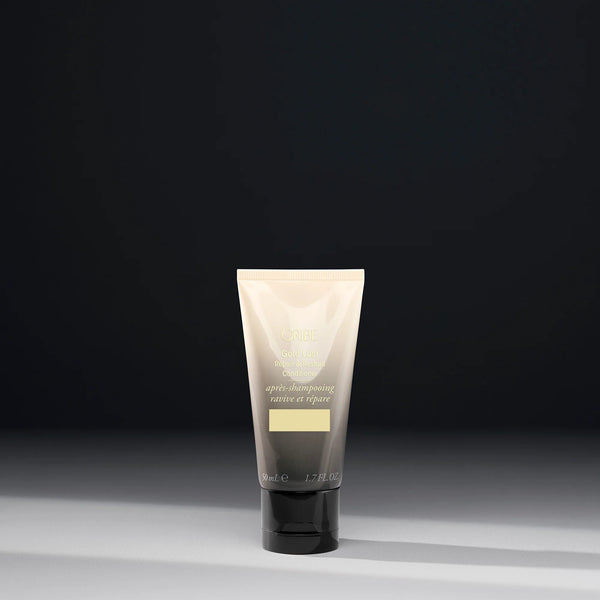 Oribe Travel Size Gold Lust Repair & Restore Conditioner 1.7 oz for damaged hair — travel-friendly deep conditioning treatment to restore strength and shine.
