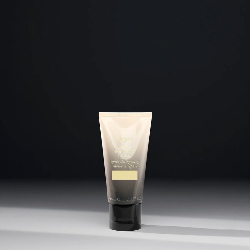Oribe Travel Size Gold Lust Repair & Restore Conditioner 1.7 oz for damaged hair — travel-friendly deep conditioning treatment to restore strength and shine.
