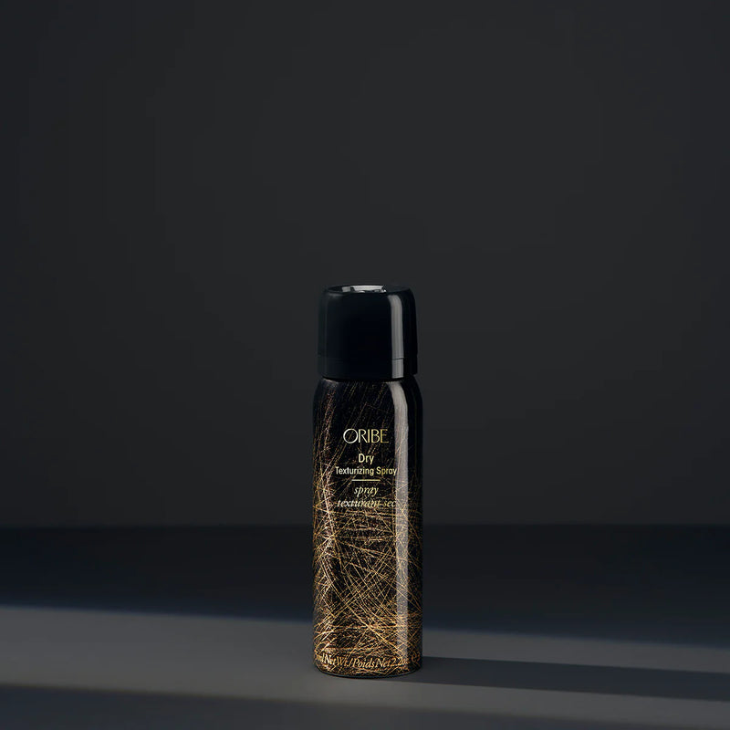Oribe Travel Size Dry Texturizing Spray 2.2 oz – invisible dry hair spray for volume, texture, and oil absorption, luxury travel-friendly styling product.