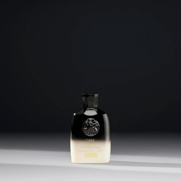 Oribe Travel Size Gold Lust Repair and Restore Shampoo for dry or damaged hair.