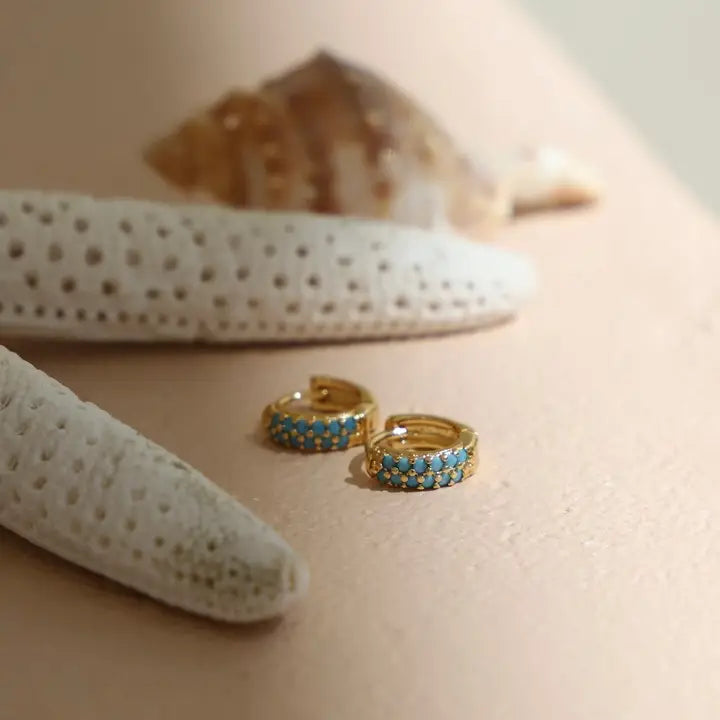 Katie Waltman Turquoise Duo Huggie Earrings featuring petite gold-plated hoops adorned with two turquoise stone accents per ear — minimal yet colorful earrings designed for effortless stacking or standalone wear.