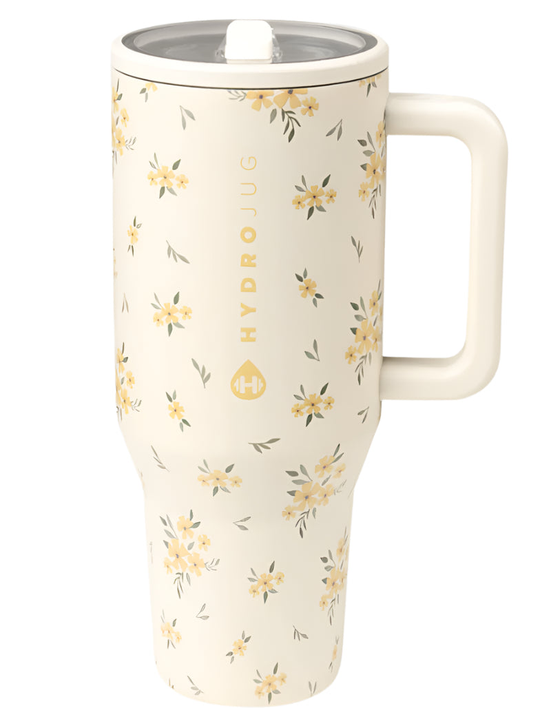 HydroJug Traveler 40 oz in Cottage Core – triple‑wall insulated stainless steel travel tumbler featuring a flip straw lid, ergonomic handle, leak‑proof design and soft‑touch matte ivory finish with delicate yellow floral cottage‑core pattern for on‑the‑go hydration.