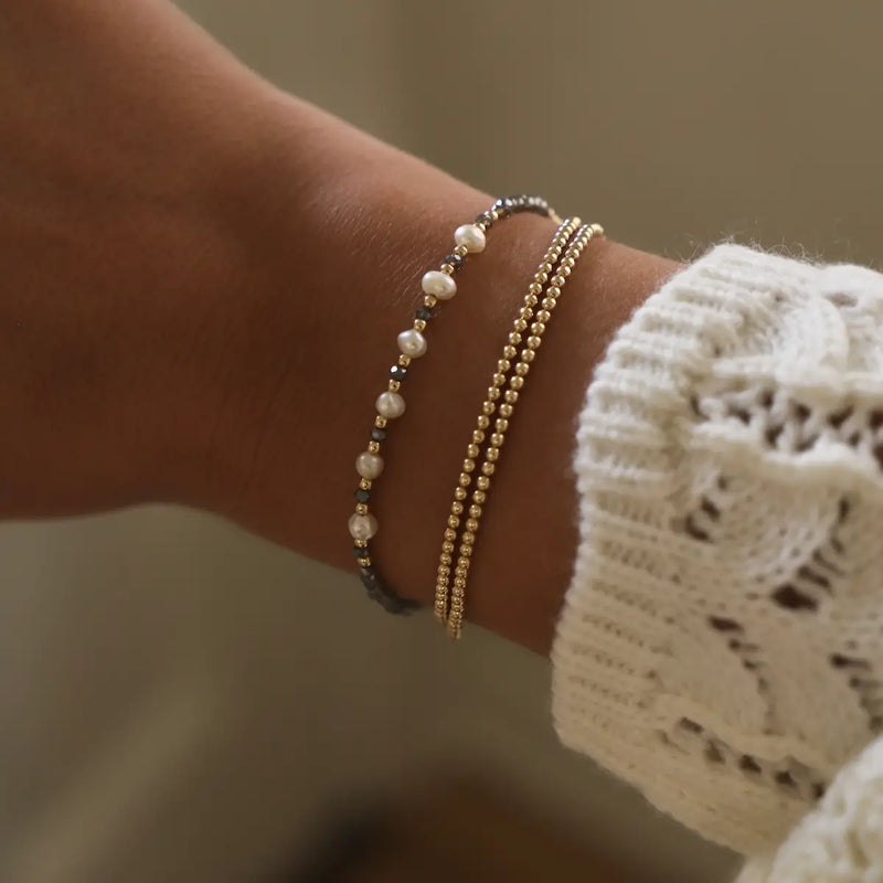 Timeless, beautiful, classic, and trending, from Katie Waltman the Gold Filled Smoky Crystal and Pearl Bracelet. This is an Elegant bracelet featuring smoky crystal accents and freshwater pearls, set in high-quality gold-filled material. Perfect for adding a touch of sophistication and glamour to any look, this bracelet is a must-have accessory for a chic, timeless style.
