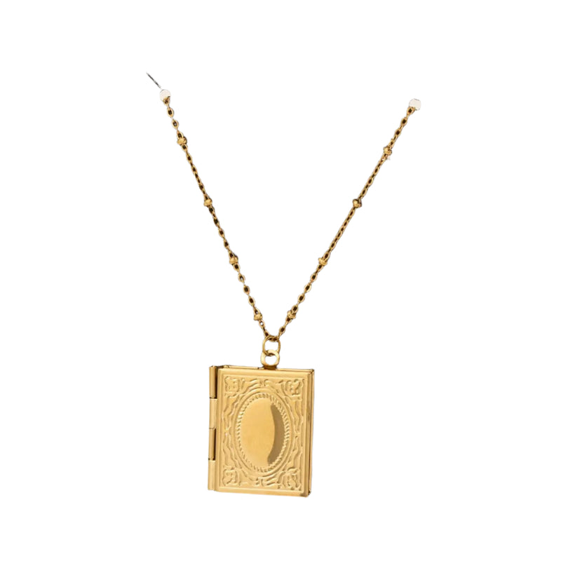 This is a unique, and timeless statement piece. The Stainless Steel Engraved Book Locket Pendant Necklace. An elegant book locket necklace crafted from durable stainless steel with intricate engraving. Perfect for holding small photos or keepsakes, this sentimental piece makes a meaningful gift.