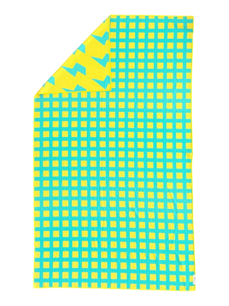 Crae Home Block Party reversible microfiber pool towel – large compact beach towel with elastic band for easy travel.