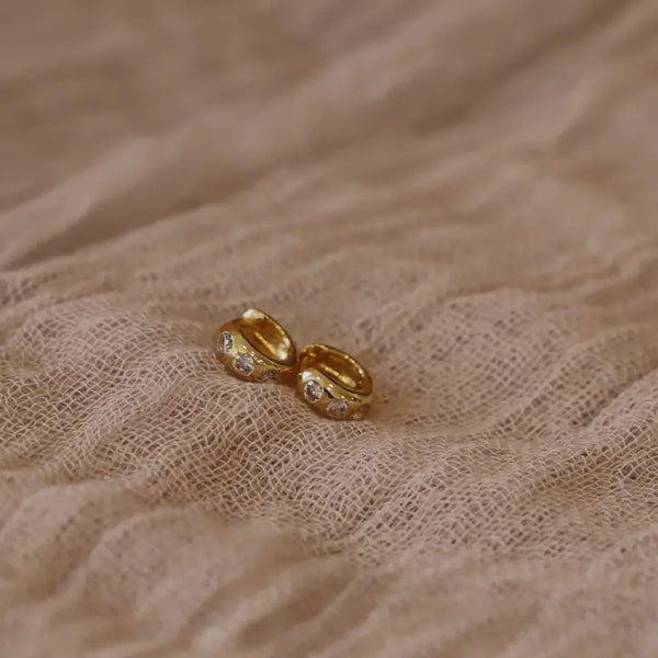 Katie Waltman Maeve Huggies in gold – small gold-plated hoop earrings with delicate cubic zirconia for a minimalist, elegant shine.