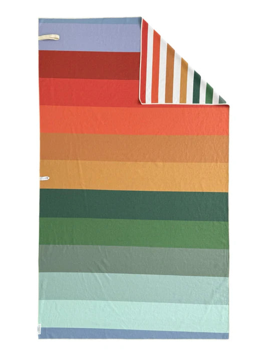 Crae Home Crew reversible microfiber pool towel with a coordinating striped pattern, waffle-weave beach towel with elastic band for compact roll carry.