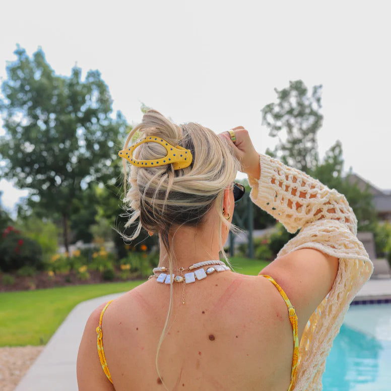 KAXI Polka Dot Lay Down 2.0 Claw in Yellow – curved matte yellow resin hair claw featuring contrasting blue polka dots, KAXI’s signature arched shape and internal teeth providing a firm yet gentle, no-crease hold even while lying down or being active.