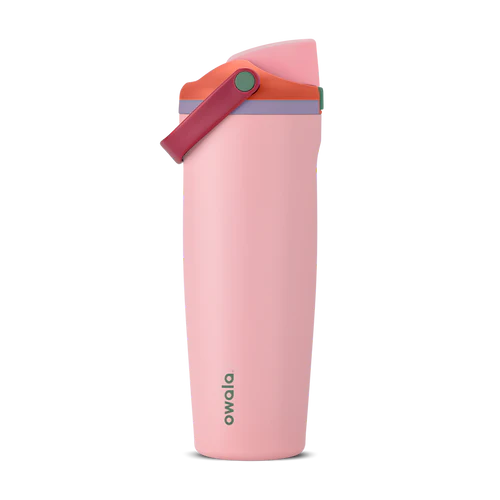Owala FreeSip Sway bottle in Sugar High – insulated stainless steel tumbler with side carry handle, leakproof dual-function lid, and matte pink body with coral, plum, and mint accents.