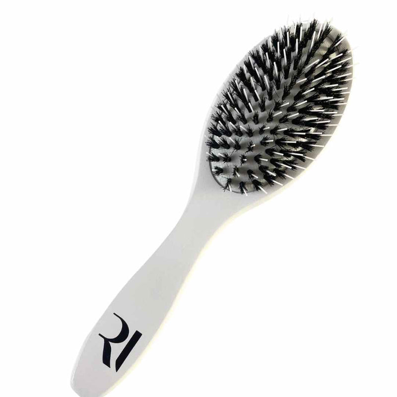 A Professional-grade double-bristle brush by Racoon International – gentle on natural and extension hair. Smooths and detangles. 