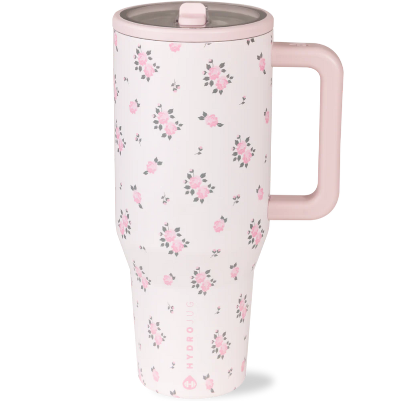 HydroJug Traveler 40 oz in Wildrose – triple-wall insulated stainless steel tumbler with ambidextrous flip straw lid, ergonomic side handle, leak‑proof design and soft‑touch matte pink‑rose with flowers.