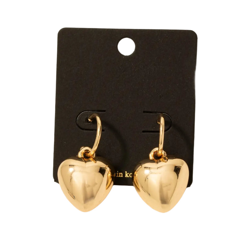 These are gorgeous, eye-catching gold plated puffy heart charm hoop earrings. They are bold and trendy gold hoop earrings featuring oversized puffy heart charms for a statement-making look. Perfect for adding a touch of romance and vintage-inspired flair to any outfit.  