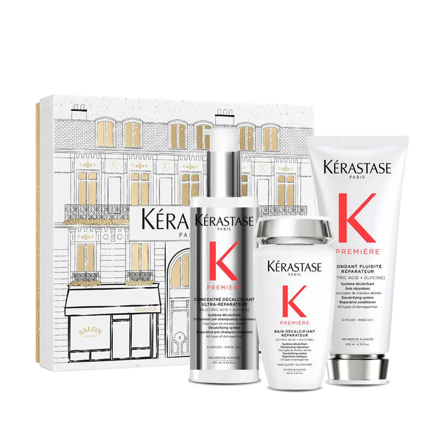 Kerastase Première Holiday Gift Set with Bain Décalcifiant Shampoo, Fondant Fluidité Conditioner and Concentré Ultra-Réparateur Treatment for repairing damaged hair and restoring strength.