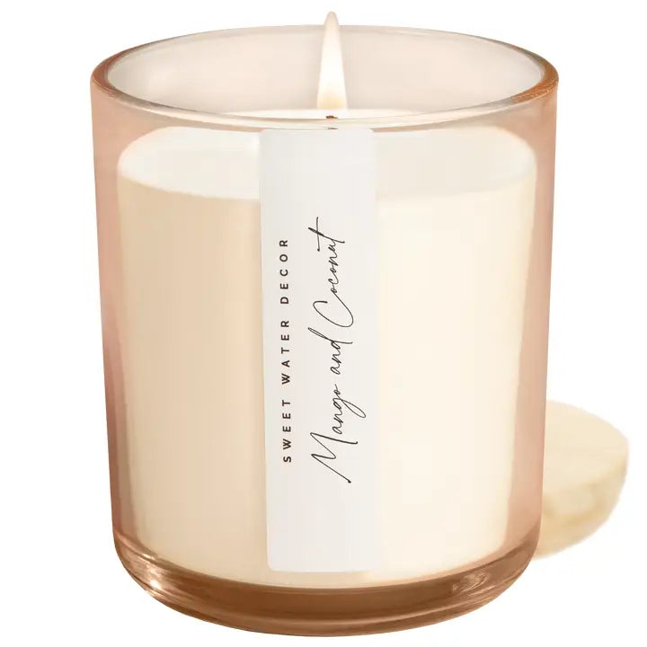 Sweet Water Decor Mango and Coconut Candle - tropical scented soy candle. Hand poured and safe ingredients' for the home. Comes in a beautifully tinted jar so it is esthetically pleasing to display in any room. The mango and coconut scent creates a fresh, tropical home ambiance. 